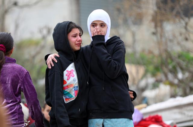 (260217) -- BETHLEHEM, Feb. 17, 2026 (Xinhua) -- Palestinians react after Israeli excavators demolished a building in the town of al-Khader, south of Bethlehem in the West Bank, Feb. 17, 2026. (Photo by Mamoun Wazwaz/Xinhua)