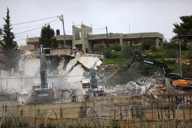 (260217) -- BETHLEHEM, Feb. 17, 2026 (Xinhua) -- Israeli excavators demolish a building in the town of al-Khader, south of Bethlehem in the West Bank, Feb. 17, 2026. (Photo by Mamoun Wazwaz/Xinhua)