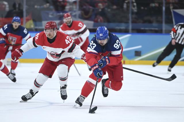 (260217) -- MILAN, Feb. 17, 2026 (Xinhua) -- Matej Stransky (R) of the Czech Republic breaks through during the ice hockey men's qualification play-off match between the Czech Republic and Denmark at the Milan-Cortina 2026 Olympic Winter Games in Milan, Italy, Feb. 17, 2026. (Xinhua/Zhang Haofu)