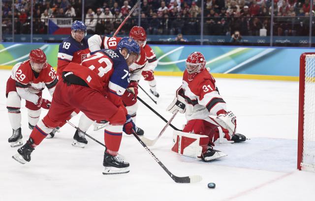 (260217) -- MILAN, Feb. 17, 2026 (Xinhua) -- Ondrej Kase (front) of the Czech Republic competes during the ice hockey men's qualification play-off match between the Czech Republic and Denmark at the Milan-Cortina 2026 Olympic Winter Games in Milan, Italy, Feb. 17, 2026. (Xinhua/Wang Kaiyan)