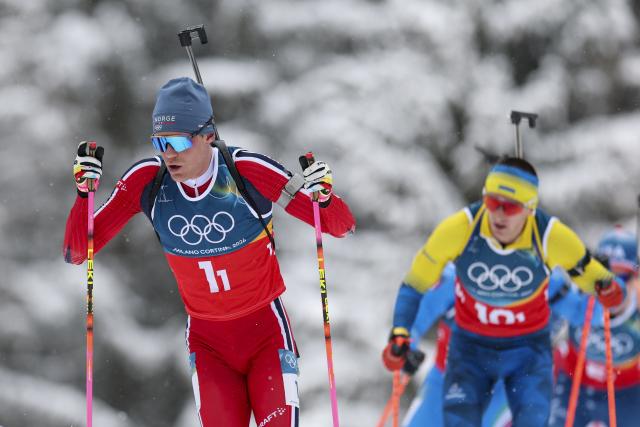 (260217) -- ANTERSELVA, Feb. 17, 2026 (Xinhua) -- Martin Uldal (L) of Norway competes during the biathlon men's 4x7.5km relay at the 2026 Milan-Cortina Winter Olympics in Anterselva, Italy, Feb. 17, 2026. (Xinhua/Zhang Tao)