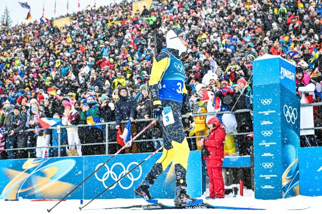 (260217) -- ANTERSELVA, Feb. 17, 2026 (Xinhua) -- Sebastian Samuelsson of Sweden crosses the finish line during the biathlon men's 4x7.5km relay at the 2026 Milan-Cortina Winter Olympics in Anterselva, Italy, Feb. 17, 2026. (Xinhua/Jiang Han)