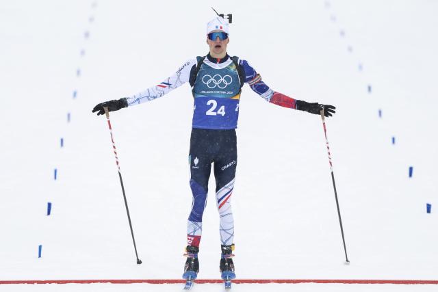 (260217) -- ANTERSELVA, Feb. 17, 2026 (Xinhua) -- Eric Perrot of France crosses the finish line during the biathlon men's 4x7.5km relay at the 2026 Milan-Cortina Winter Olympics in Anterselva, Italy, Feb. 17, 2026. (Xinhua/Zhang Tao)