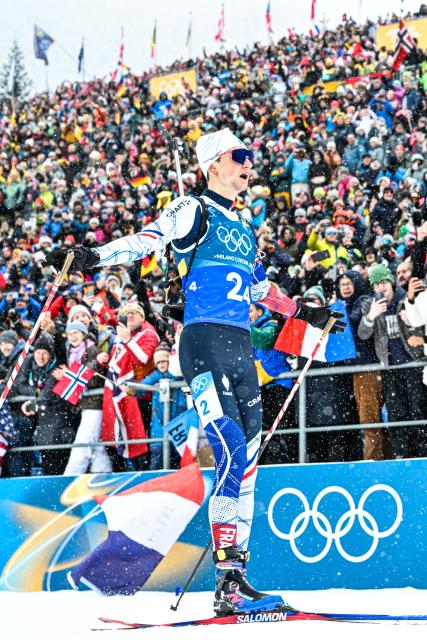 (260217) -- ANTERSELVA, Feb. 17, 2026 (Xinhua) -- Eric Perrot of France crosses the finish line during the biathlon men's 4x7.5km relay at the 2026 Milan-Cortina Winter Olympics in Anterselva, Italy, Feb. 17, 2026. (Xinhua/Jiang Han)