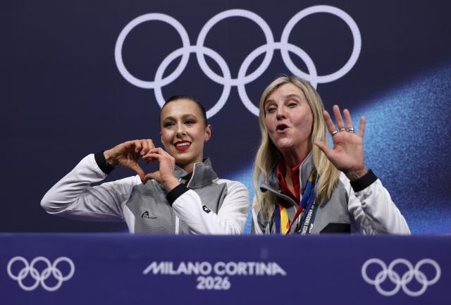 (260217) -- MILAN, Feb. 17, 2026 (Xinhua) -- Livia Kaiser (L) of Switzerland gestures after the short program match of figure skating women single skating at the Milan-Cortina 2026 Olympic Winter Games in Milan, Italy, Feb. 17, 2026. (Xinhua/Chen Yichen)