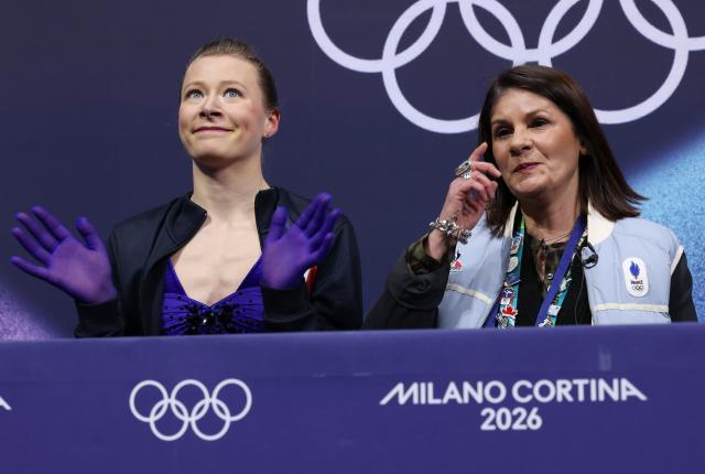 (260217) -- MILAN, Feb. 17, 2026 (Xinhua) -- Lorine Schild (L) of France reacts after the short program match of figure skating women single skating at the Milan-Cortina 2026 Olympic Winter Games in Milan, Italy, Feb. 17, 2026. (Xinhua/Chen Yichen)