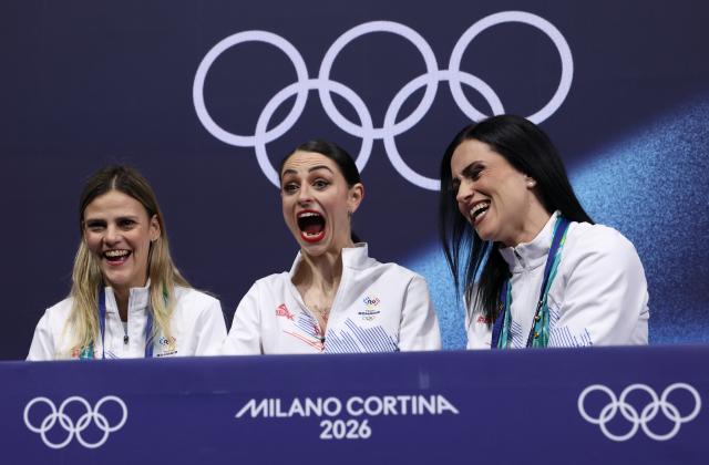 (260217) -- MILAN, Feb. 17, 2026 (Xinhua) -- Julia Sauter (C) of Romania waits for her score after the short program match of figure skating women single skating at the Milan-Cortina 2026 Olympic Winter Games in Milan, Italy, Feb. 17, 2026. (Xinhua/Chen Yichen)