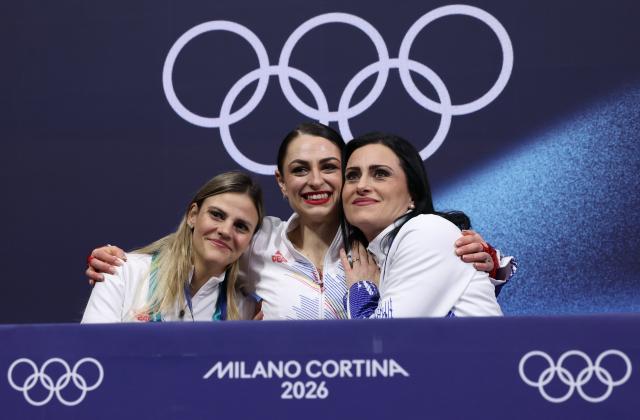(260217) -- MILAN, Feb. 17, 2026 (Xinhua) -- Julia Sauter (C) of Romania waits for her score after the short program match of figure skating women single skating at the Milan-Cortina 2026 Olympic Winter Games in Milan, Italy, Feb. 17, 2026. (Xinhua/Chen Yichen)
