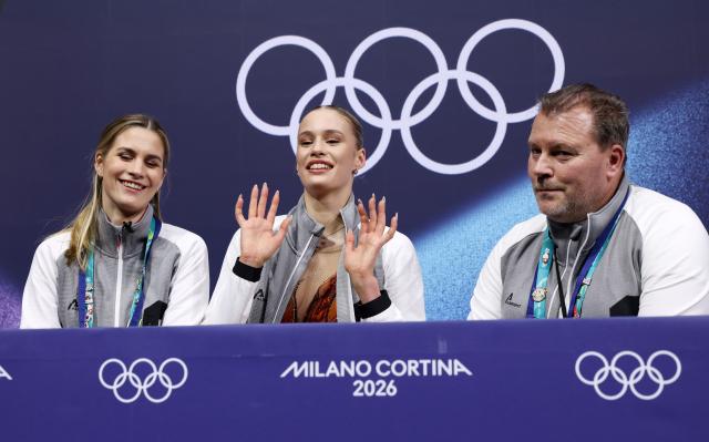 (260217) -- MILAN, Feb. 17, 2026 (Xinhua) -- Kimmy Repond (C) of Switzerland waits for her score after the short program match of figure skating women single skating at the Milan-Cortina 2026 Olympic Winter Games in Milan, Italy, Feb. 17, 2026. (Xinhua/Chen Yichen)
