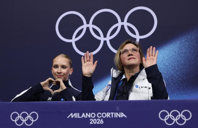 (260217) -- MILAN, Feb. 17, 2026 (Xinhua) -- Iida Karhunen (L) of Finland waits for her score after the short program match of figure skating women single skating at the Milan-Cortina 2026 Olympic Winter Games in Milan, Italy, Feb. 17, 2026. (Xinhua/Chen Yichen)
