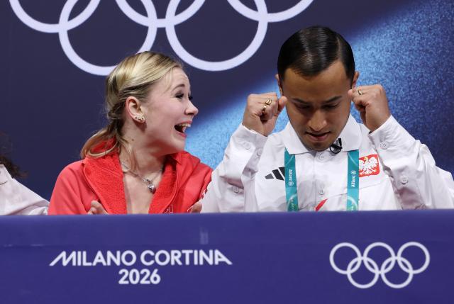 (260217) -- MILAN, Feb. 17, 2026 (Xinhua) -- Ekaterina Kurakova (L) of Poland reacts after the short program match of figure skating women single skating at the Milan-Cortina 2026 Olympic Winter Games in Milan, Italy, Feb. 17, 2026. (Xinhua/Chen Yichen)