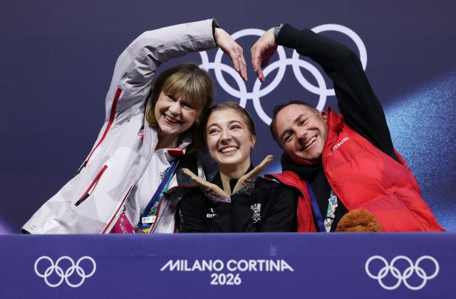 (260217) -- MILAN, Feb. 17, 2026 (Xinhua) -- Olga Mikutina (C) of Austria gestures after the short program match of figure skating women single skating at the Milan-Cortina 2026 Olympic Winter Games in Milan, Italy, Feb. 17, 2026. (Xinhua/Chen Yichen)