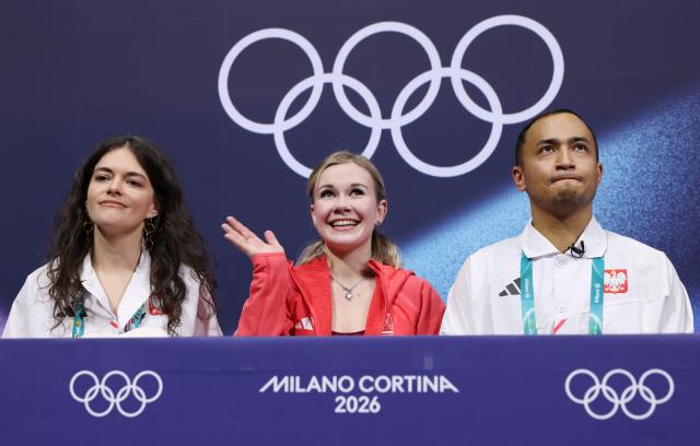 (260217) -- MILAN, Feb. 17, 2026 (Xinhua) -- Ekaterina Kurakova (C) of Poland gestures after the short program match of figure skating women single skating at the Milan-Cortina 2026 Olympic Winter Games in Milan, Italy, Feb. 17, 2026. (Xinhua/Chen Yichen)