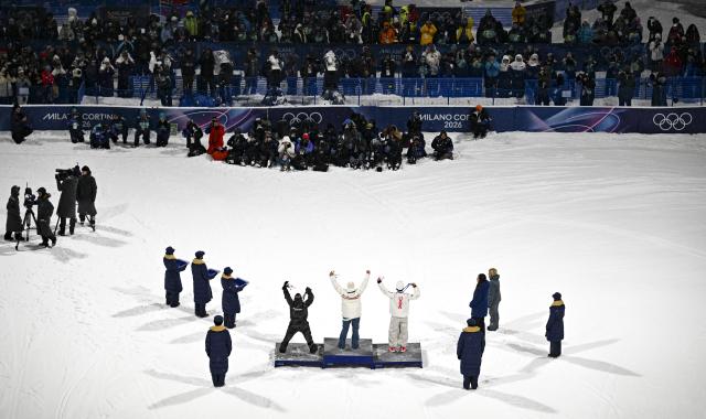 (260218) -- LIVIGNO, Feb. 18, 2026 (Xinhua) -- Gold medalist Tormod Frostad (C) of Norway, silver medalist Mac Forehand (R) of the United States and bronze medalist Matej Svancer of Austria celebrate on the podium during the victory ceremony for Freestyle Skiing Men's Freeski Big Air at the Milan-Cortina 2026 Olympic Winter Games in Livigno, Italy, Feb. 17, 2026. (Xinhua/Xia Yifang)