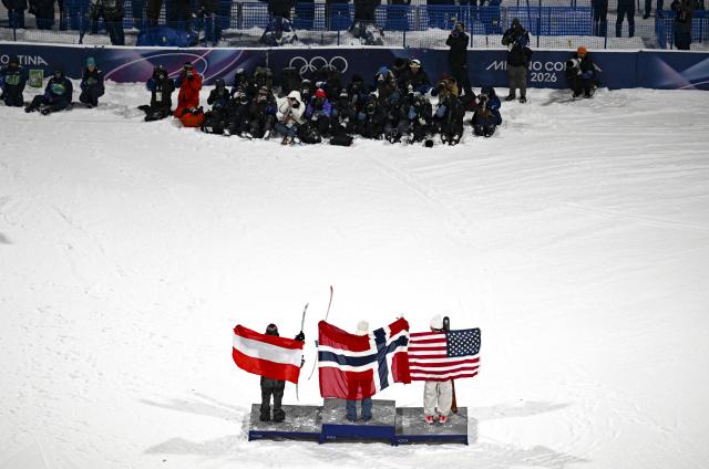 (260218) -- LIVIGNO, Feb. 18, 2026 (Xinhua) -- Gold medalist Tormod Frostad (C) of Norway, silver medalist Mac Forehand (R) of the United States and bronze medalist Matej Svancer of Austria celebrate on the podium during the victory ceremony for Freestyle Skiing Men's Freeski Big Air at the Milan-Cortina 2026 Olympic Winter Games in Livigno, Italy, Feb. 17, 2026. (Xinhua/Xia Yifang)