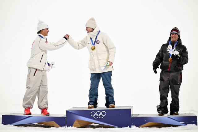(260218) -- LIVIGNO, Feb. 18, 2026 (Xinhua) -- Gold medalist Tormod Frostad (C) of Norway greets with silver medalist Mac Forehand (L) of the United States as bronze medalist Matej Svancer of Austria looks on during the victory ceremony for Freestyle Skiing Men's Freeski Big Air at the Milan-Cortina 2026 Olympic Winter Games in Livigno, Italy, Feb. 17, 2026. (Xinhua/Zhang Hongxiang)