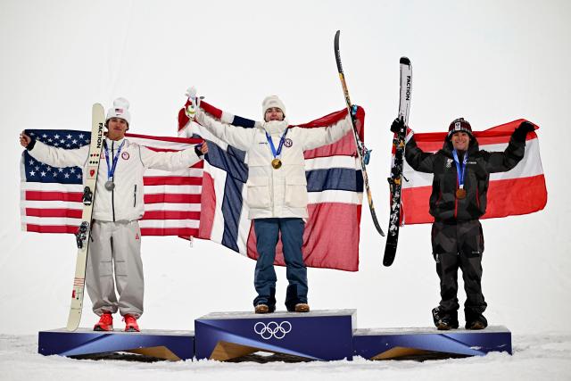 (260218) -- LIVIGNO, Feb. 18, 2026 (Xinhua) -- Gold medalist Tormod Frostad (C) of Norway, silver medalist Mac Forehand (L) of the United States and bronze medalist Matej Svancer of Austria celebrate on the podium during the victory ceremony for Freestyle Skiing Men's Freeski Big Air at the Milan-Cortina 2026 Olympic Winter Games in Livigno, Italy, Feb. 17, 2026. (Xinhua/Zhang Hongxiang)