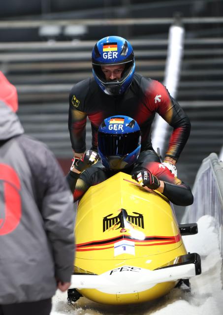 (260218) -- CORTINA D'AMPEZZO, Feb. 18, 2026 (Xinhua) -- Johannes Lochner (front)/Georg Fleischhauer of Germany celebrate after winning the Bobsleigh 2-man at the Milan-Cortina 2026 Olympic Winter Games in Cortina D'Ampezzo, Italy, Feb. 17, 2026. (Xinhua/Ding Xu)