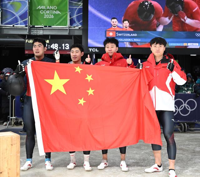 (260218) -- CORTINA D'AMPEZZO, Feb. 18, 2026 (Xinhua) -- An Tai, Sun Kaizhi, Li Chunjian and Ye Jielong (L to R) pose after the Bobsleigh 2-man event at the Milan-Cortina 2026 Olympic Winter Games in Cortina D'Ampezzo, Italy, Feb. 17, 2026. (Xinhua/Lian Yi)