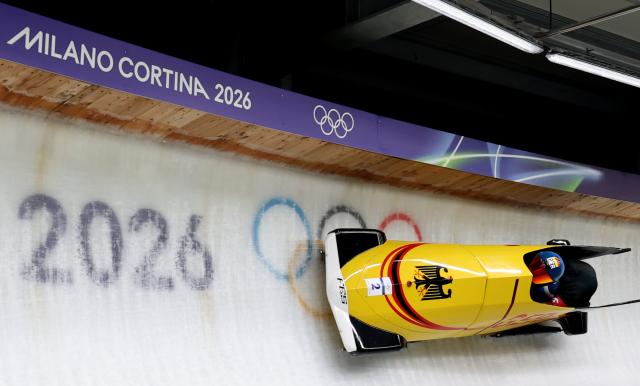 (260218) -- CORTINA D'AMPEZZO, Feb. 18, 2026 (Xinhua) -- Francesco Friedrich (L)/Alexander Schuller of Germany compete during the Bobsleigh 2-man heat 3 at the Milan-Cortina 2026 Olympic Winter Games in Cortina D'Ampezzo, Italy, Feb. 17, 2026. (Xinhua/Ding Xu)