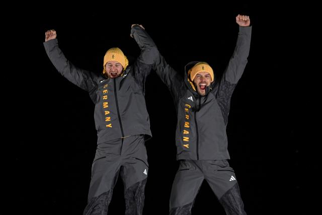 (260218) -- CORTINA D'AMPEZZO, Feb. 18, 2026 (Xinhua) -- Gold medalists Johannes Lochner (L)/Georg Fleischhauer Germany celebrate during the awarding ceremony for the Bobsleigh 2-man at the Milan-Cortina 2026 Olympic Winter Games in Cortina D'Ampezzo, Italy, Feb. 17, 2026. (Xinhua/Lian Yi)