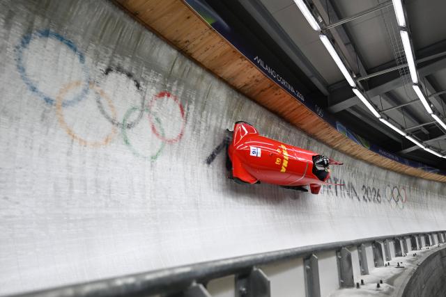 (260218) -- CORTINA D'AMPEZZO, Feb. 18, 2026 (Xinhua) -- Sun Kaizhi (L)/An Tai of China compete during the Bobsleigh 2-man heat 3 at the Milan-Cortina 2026 Olympic Winter Games in Cortina D'Ampezzo, Italy, Feb. 17, 2026. (Xinhua/Lian Yi)