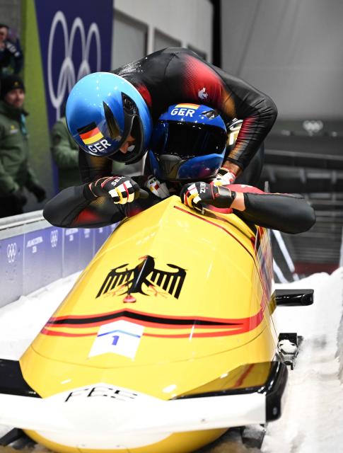 (260218) -- CORTINA D'AMPEZZO, Feb. 18, 2026 (Xinhua) -- Johannes Lochner (front)/Georg Fleischhauer of Germany celebrate after winning the Bobsleigh 2-man at the Milan-Cortina 2026 Olympic Winter Games in Cortina D'Ampezzo, Italy, Feb. 17, 2026. (Xinhua/Lian Yi)
