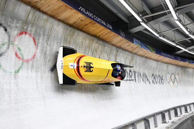 (260218) -- CORTINA D'AMPEZZO, Feb. 18, 2026 (Xinhua) -- Adam Ammour (L)/Alexander Schaller of Germany compete during the Bobsleigh 2-man heat 3 at the Milan-Cortina 2026 Olympic Winter Games in Cortina D'Ampezzo, Italy, Feb. 17, 2026. (Xinhua/Lian Yi)