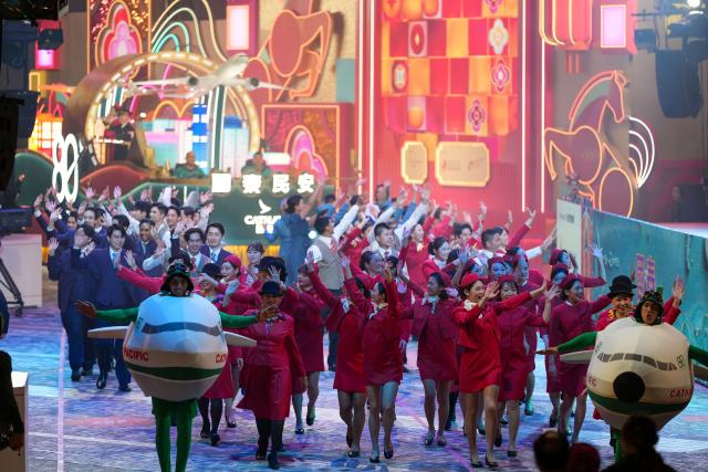 (260218) -- HONG KONG, Feb. 18, 2026 (Xinhua) -- Performers attend an international night parade celebrating the Year of the Horse in Hong Kong, south China, Feb. 17, 2026. An international night parade celebrating the Year of the Horse was held in Hong Kong on Tuesday evening, kicking off a series of festive highlight programs for the Chinese New Year. (Xinhua/Zhu Wei)