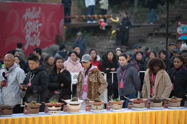 (260218) -- GUANGDE, Feb. 18, 2026 (Xinhua) -- Sasha (front, 3rd R) attends a cooking competition in Dongting Town of Guangde City, east China's Anhui Province, Jan. 18, 2026. Sasha, an equestrian from Russia, once studied in Shanghai and later went to Europe to study equestrian sports, where she met coach Vasil and eventually married him. They have a lovely daughter named Maya. In 2023, Sasha's family moved to Guangde to start a new life, as her husband Vasil was invited to teach at the Yangtze River Delta International Equestrian Center.
  "Riding has always been my favorite," Sasha said in Chinese. Sasha's family now lives near the equestrian center, where she trains daily in equestrian show jumping, takes walks with her beloved horse, and sometimes helps with horse training. Looking ahead, she hopes to participate in more equestrian competitions and to one day own her own ranch.
  Beyond the racetrack, Sasha engages in cultural activities to learn about local customs and traditions. Her daughter Maya attends a local kindergarten and has learned Chinese. Her husband Vasil's equestrian teaching is well received by students. These experiences have helped Sasha feel a sense of belonging in a place once unfamiliar to her. "Guangde is picturesque and has friendly people. Living and training here makes me feel wonderful," said Sasha. (Xinhua/Zhang Duan)