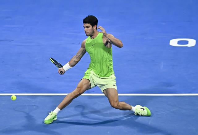 (260218) -- DOHA, Feb. 18, 2026 (Xinhua) -- Carlos Alcaraz of Spain hits a return during the men's singles round of 32 match against Arthur Rinderknech of France at the ATP Qatar Open 2026 tennis tournament in Doha, Qatar, on Feb. 17, 2026. (Photo by Nikku/Xinhua)