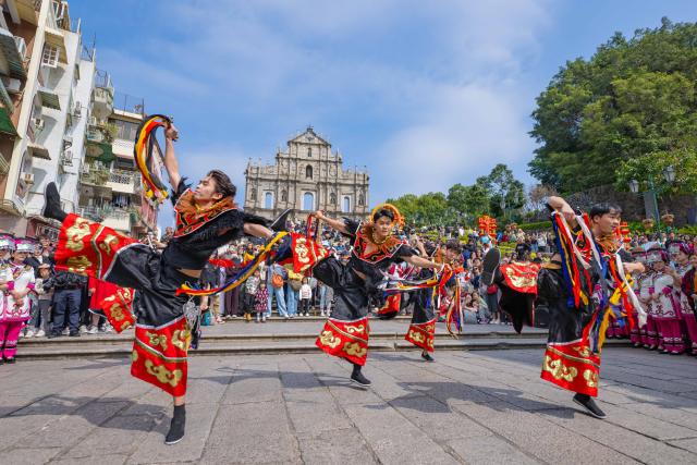 (260218) -- MACAO, Feb. 18, 2026 (Xinhua) -- Dancers from southwest China's Guizhou Province perform during a celebration of the Spring Festival in front of the Ruins of St. Paul's in south China's Macao, Feb. 18, 2026. (Xinhua/Cheong Kam Ka)