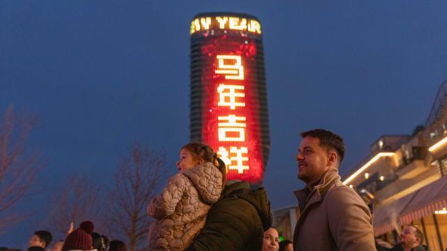 (260218) -- BELGRADE, Feb. 18, 2026 (Xinhua) -- People watch a lion dance performance as the Belgrade Tower is illuminated with festive greetings in Chinese during an event celebrating the Spring Festival in Belgrade, Serbia, Feb. 16, 2026. A series of events celebrating the Spring Festival were held here on Monday and Tuesday, creating a festive atmosphere and attracting thousands of local residents and members from the Chinese community. (Photo by Wang Wei/Xinhua)