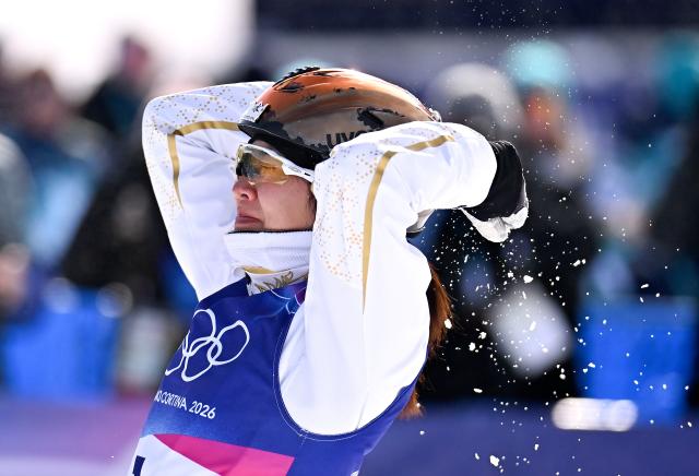 (260218) -- LIVIGNO, Feb. 18, 2026 (Xinhua) -- Xu Mengtao of China reacts after the freestyle skiing women's aerials final 2 at the Milan-Cortina 2026 Olympic Winter Games in Livigno, Italy, Feb. 18, 2026. (Xinhua/Zhang Hongxiang)