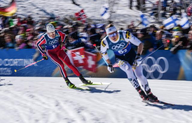 (260218) -- TESERO, Feb. 18, 2026 (Xinhua) -- Johannes Hoesflot Klaebo (L) of Norway competes during the cross-country skiing men's team sprint free final at the Milan-Cortina 2026 Olympic Winter Games in Tesero, Italy, Feb. 18, 2026. (Xinhua/Peng Ziyang)