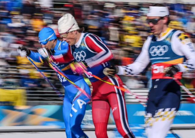 (260218) -- TESERO, Feb. 18, 2026 (Xinhua) -- Johannes Hoesflot Klaebo (C) of Norway competes during the cross-country skiing men's team sprint free final at the Milan-Cortina 2026 Olympic Winter Games in Tesero, Italy, Feb. 18, 2026. (Xinhua/Peng Ziyang)
