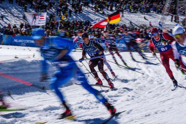 (260218) -- TESERO, Feb. 18, 2026 (Xinhua) -- Athletes compete during the cross-country skiing men's team sprint free final at the Milan-Cortina 2026 Olympic Winter Games in Tesero, Italy, Feb. 18, 2026. (Xinhua/Peng Ziyang)