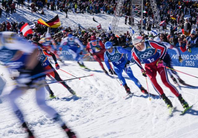 (260218) -- TESERO, Feb. 18, 2026 (Xinhua) -- Athletes compete during the cross-country skiing men's team sprint free final at the Milan-Cortina 2026 Olympic Winter Games in Tesero, Italy, Feb. 18, 2026. (Xinhua/Peng Ziyang)