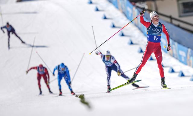 (260218) -- TESERO, Feb. 18, 2026 (Xinhua) -- Johannes Hoesflot Klaebo (1st R) of Norway crosses the finish line during the cross-country skiing men's team sprint free final at the Milan-Cortina 2026 Olympic Winter Games in Tesero, Italy, Feb. 18, 2026. (Xinhua/Peng Ziyang)