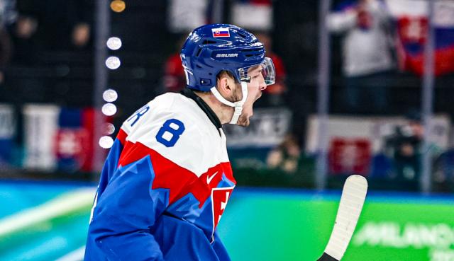 (260218) -- MILAN, Feb. 18, 2026 (Xinhua) -- Oliver Okuliar of Slovakia celebrates scoring during the ice hockey men's play-offs quarterfinal between the Slovakia and Germany at the Milan-Cortina 2026 Olympic Winter Games in Milan, Italy, Feb. 18, 2026. (Xinhua/Wang Kaiyan)