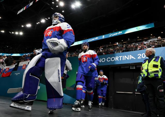 (260218) -- MILAN, Feb. 18, 2026 (Xinhua) -- Players of Slovakia walks into the venue before the ice hockey men's play-offs quarterfinal between the Slovakia and Germany at the Milan-Cortina 2026 Olympic Winter Games in Milan, Italy, Feb. 18, 2026. (Xinhua/Wang Kaiyan)