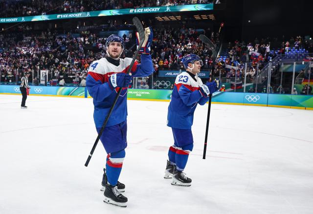 (260218) -- MILAN, Feb. 18, 2026 (Xinhua) -- Pavol Regenda (L) and Adam Liska of Slovakia greet the spectators after the ice hockey men's play-offs quarterfinal between the Slovakia and Germany at the Milan-Cortina 2026 Olympic Winter Games in Milan, Italy, Feb. 18, 2026. (Xinhua/Wang Kaiyan)