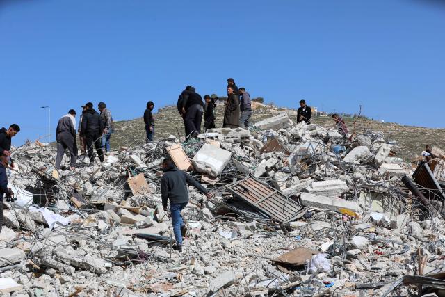(260218) -- HEBRON, Feb. 18, 2026 (Xinhua) -- Palestinians inspect damage after Israeli excavators demolished a Palestinian residential building in the southern West Bank city of Hebron on Feb. 18, 2026. (Photo by Mamoun Wazwaz/Xinhua)