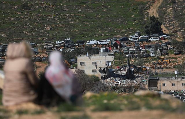 (260218) -- HEBRON, Feb. 18, 2026 (Xinhua) -- Photo shows Israeli excavators demolishing a Palestinian residential building in the southern West Bank city of Hebron on Feb. 18, 2026. (Photo by Mamoun Wazwaz/Xinhua)
