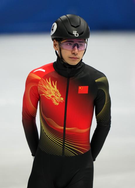 (260218) -- MILAN, Feb. 18, 2026 (Xinhua) -- Liu Shaoang of China reacts after the short track speed skating men's 500m quarterfinal at the Milan-Cortina 2026 Olympic Winter Games in Milan, Italy, Feb. 18, 2026. (Xinhua/Lai Xiangdong)