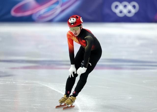 (260218) -- MILAN, Feb. 18, 2026 (Xinhua) -- Lin Xiaojun of China reacts after the short track speed skating men's 500m quarterfinal at the Milan-Cortina 2026 Olympic Winter Games in Milan, Italy, Feb. 18, 2026. (Xinhua/Li Ming)