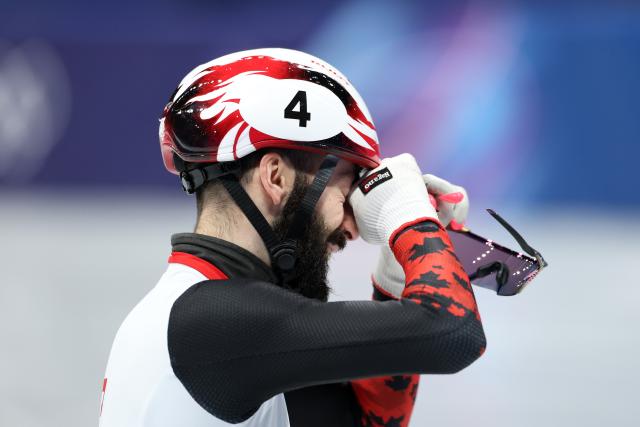(260218) -- MILAN, Feb. 18, 2026 (Xinhua) -- Steven Dubois of Canada weeps after the short track speed skating men's 500m final A at the Milan-Cortina 2026 Olympic Winter Games in Milan, Italy, Feb. 18, 2026. (Xinhua/Li Ming)