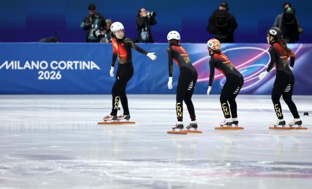 (260218) -- MILAN, Feb. 18, 2026 (Xinhua) -- Zhang Chutong, Wang Xinran, Yang Jingru and Gong Li (L to R) of China react after the short track speed skating women's 3000m relay final B at the Milan-Cortina 2026 Olympic Winter Games in Milan, Italy, Feb. 18, 2026. (Xinhua/Li Ming)
