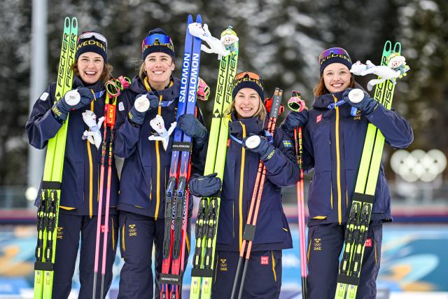 (260218) -- ANTERSELVA, Feb. 18, 2026 (Xinhua) -- Silver medalists of Sweden pose for photos during the awarding ceremony of the biathlon women's 4x6km relay at the 2026 Milan-Cortina Winter Olympics in Anterselva, Italy, Feb. 18, 2026. (Xinhua/Jiang Han)