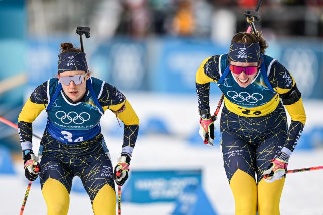 (260218) -- ANTERSELVA, Feb. 18, 2026 (Xinhua) -- Elvira Oeberg (R) and Hanna Oeberg of Sweden compete during the biathlon women's 4x6km relay at the 2026 Milan-Cortina Winter Olympics in Anterselva, Italy, Feb. 18, 2026. (Xinhua/Jiang Han)